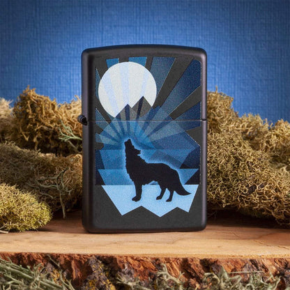 Wolf and Moon Design Windproof Lighter on tree stump with moss in background